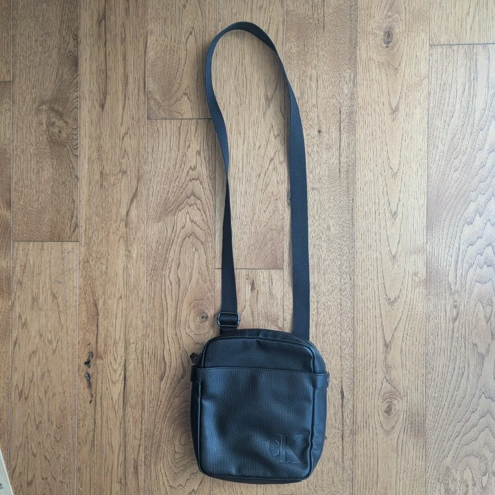 Calvin Klein Crossbody Bag Black Vegan Leather Embossed Logo Minimalist Travel